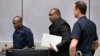 Jean-Pierre Bemba enters the courtroom of the International Criminal Court in The Hague, Netherlands, March 21, 2016. The court's judges handed him a guilty verdict.