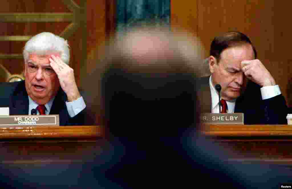 Christopher Dodd (L), chairman of the U.S. Senate Banking Committee and Senator Richard Shelby (R-AL) listen to testimony from the leaders of the big Detroit automakers during hearing on a financial assistance package for the companies in Washington, December 2008.