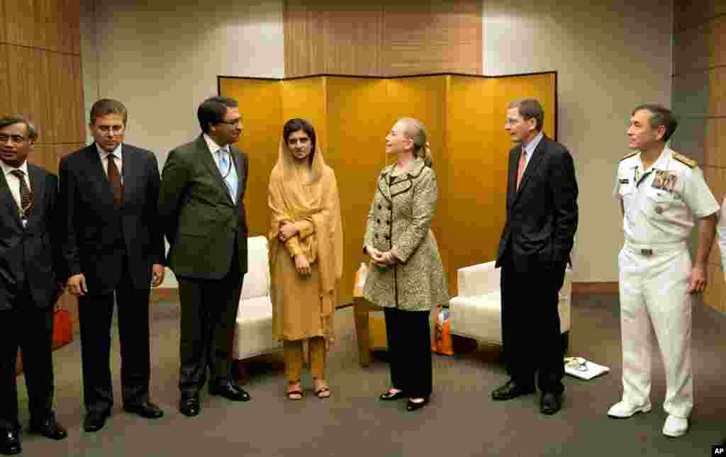 Secretary Clinton and Pakistan Foreign Minister Hina Rabbani Khar, center left, pose before a bilateral meeting in Tokyo, July 8.