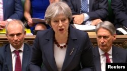 PM Inggris Theresa May memberikan pidato di hadapan parlemen Inggris, Rabu (14/3). 