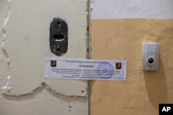 The office of Amnesty International is sealed by Moscow city authorities in Moscow, Russia, Nov. 2, 2016.