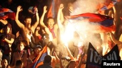 FILE - CSKA Moscow fans are seen chanting at a match at the Arena Khimki outside the Russian capital.