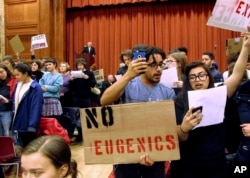 Middlebury College students turn their backs to conservative author Charles Murray during his lecture in Middlebury, Vermont.