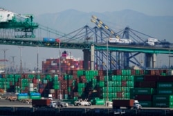 Containers are stacked at the Port of Los Angeles in Los Angeles, Oct. 1, 2021.