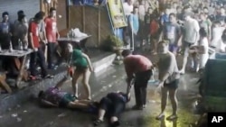 Image taken from video released by the Hua Hin Municipality an elderly British couple and their son are on the ground after they were savagely attacked during a family vacation in Hua, Hin, Thailand, April 13, 2016.
