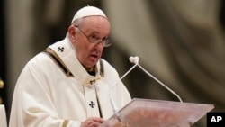 Pope Francis celebrates Christmas Eve Mass, at St. Peter's Basilica, at the Vatican, Dec. 24, 2021.