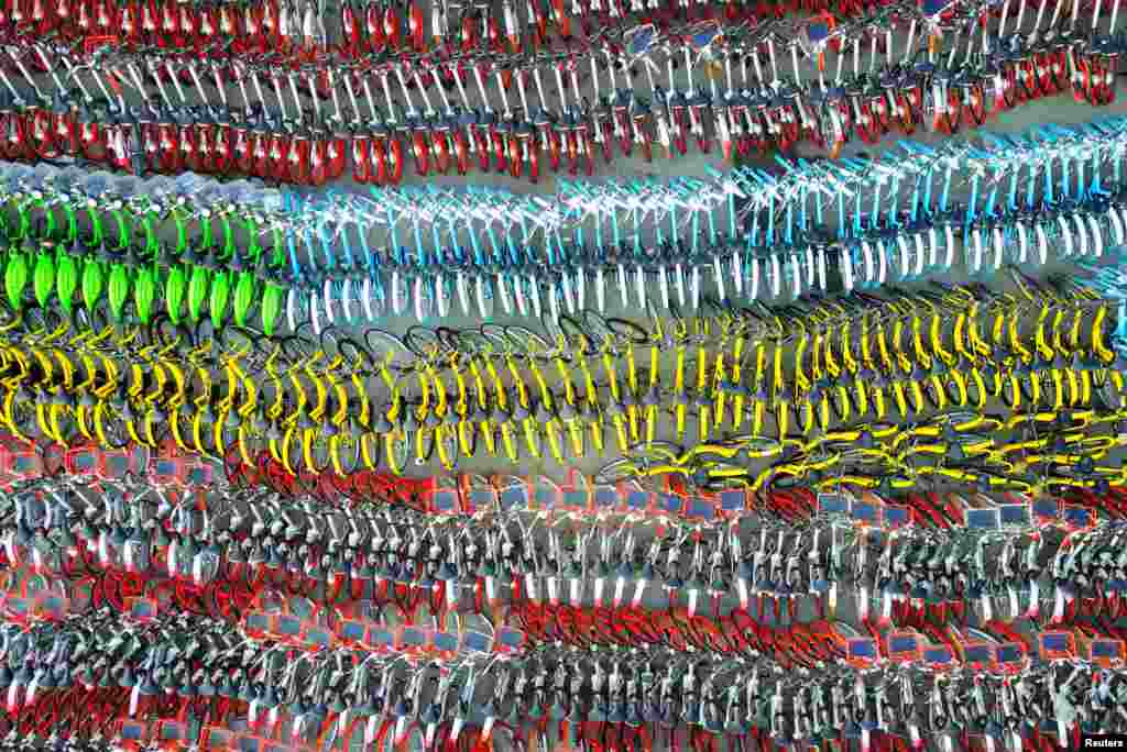 Confiscated sharing bicycles of different brands are seen at a parking lot of Huangpu District Vehicle Management Company in Shanghai, China.