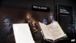 An exhibit discussing slavery in the United States is displayed inside the Museum of the Bible, Monday, Oct. 30, 2017, in Washington. (AP Photo/Jacquelyn Martin)