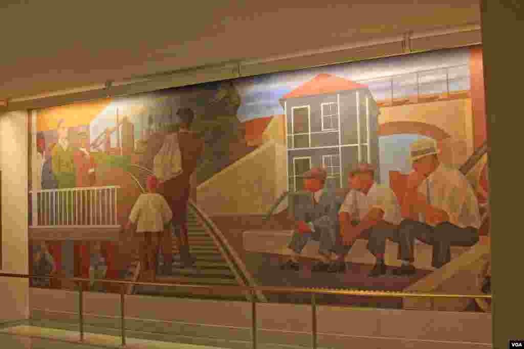 Ben Shahn tells the story of the American experience before and after the passage of the Social Security Act in his mural "The Meaning of Social Security." An East Wall panel depicts unemployment