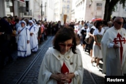 People take part in the St. Anthony procession in Lisbon, Portugal, June 13, 2018.