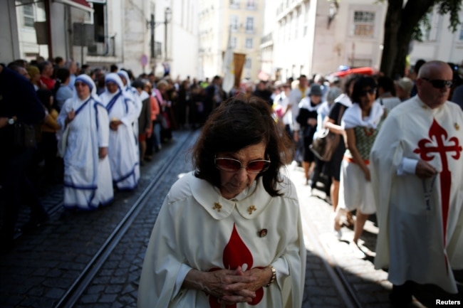 People take part in the St. Anthony procession in Lisbon, Portugal, June 13, 2018.