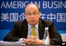 FILE - Lester Ross, chairman of the Policy Committee of the American Chamber of Commerce in China, speaks during a press conference in Beijing for the chamber's annual report on American business in China, Apr. 18, 2017.