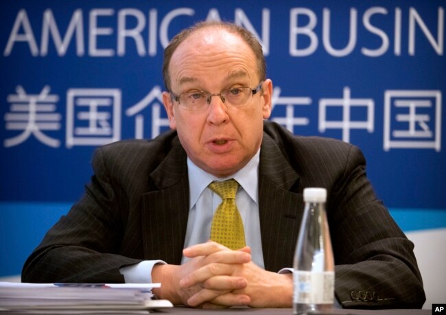 FILE - Lester Ross, chairman of the Policy Committee of the American Chamber of Commerce in China, speaks during a press conference in Beijing for the chamber's annual report on American business in China, Apr. 18, 2017.