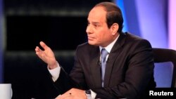 FILE- Presidential candidate and Egypt's former army chief Abdel Fattah el-Sissi talks during a television interview broadcast on CBC and ONTV, in Cairo, May 6, 2014.