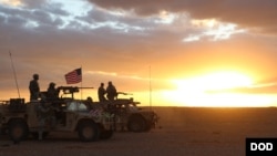 FILE - U.S. troops conduct training during operations at Al Tanf Garrison in southern Syria, Nov. 21, 2017.