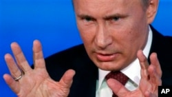 Russian President Vladimir Putin speaks during a news conference in Moscow, Russia, Dec. 20, 2012.