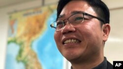 North Korean defector Ji Seong-ho smiles during an interview at his office in Seoul, South Korea, Feb. 13, 2018. 