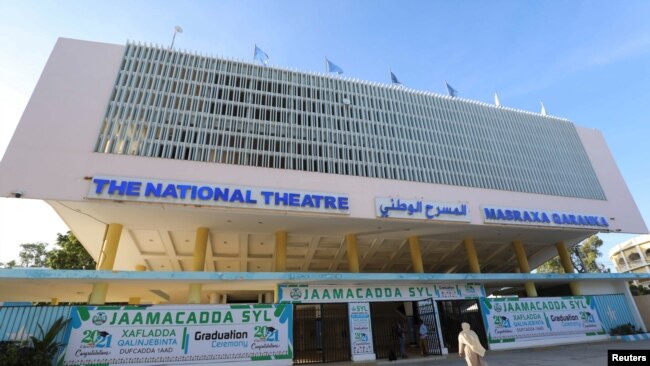 People arrive at the newly rebuilt National Theater, to watch the first film festival held in the capital of Mogadishu, Somalia, Sept. 22, 2021