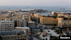 FILE - A general view shows the Greek-Orthodox Cathedral of Saint George (L), the Amir Assaf Mosque (C), and hotel Le Gray (R) in Beirut's central district, April 5, 2010.