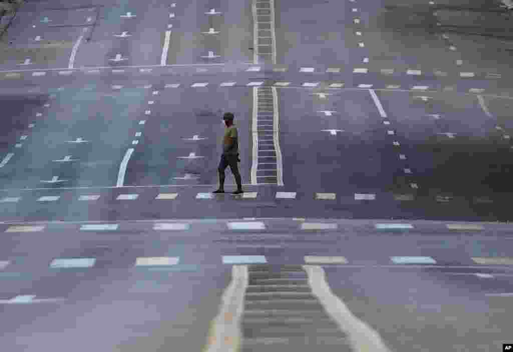 A man walks on an empty street during curfew in Havana, Cuba, Sept. 1, 2020. Authorities launched a strict 15-day lockdown of Havana in order to stamp out the low-level but persistent spread of the novel coronavirus in the capital.