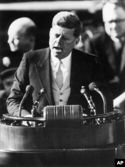 FILE - President John F. Kennedy delivers his inaugural address after taking the oath of office at the Capitol in Washington, D.C., Jan. 20, 1961.