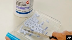 FILE - Deaths from synthetic opioids, including fentanyl, rose 73 percent. Prescription painkillers took the highest toll with deaths from Oxycontin and Vicodin increasing just 4 percent, according to government data.
