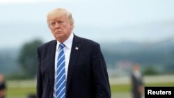 President Donald Trump boards Air Force One as he departs Hagerstown, Maryland, after holding a meeting at nearby Camp David with the National Security Council, Aug. 18, 2017. 