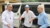 In this photo released by the Hue Archdiocese, Father Nguyen Van Ly returns home after his release from prison.