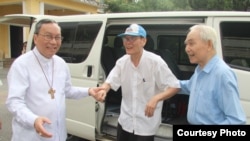 In this photo released by the Hue Archdiocese, Father Nguyen Van Ly returns home after his release from prison.