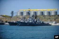 FILE - A March 31, 2014 photo shows Russian Black Sea fleet ships anchored in one of the bays of Sevastopol, Crimea.