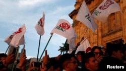 Revolutionary Alternative Force of the Common (FARC) Political party flags are seen during a protest in support of the Special Jurisdiction for Peace (JEP) in Bogota, Colombia, March 13, 2019. 