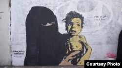 FILE - A mural named "A Boy of Bones," painted by Yemeni artist Haifa Subay. The mural seeks to warn about the risk of famine, which is threatening the lives of millions of children in Yemen.