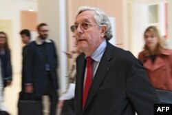 FILE - French government attorney Xavier Normand Bodard arrives at Paris' courthouse, Oct. 8, 2018 , prior to the trial of Swiss Bank UBS.