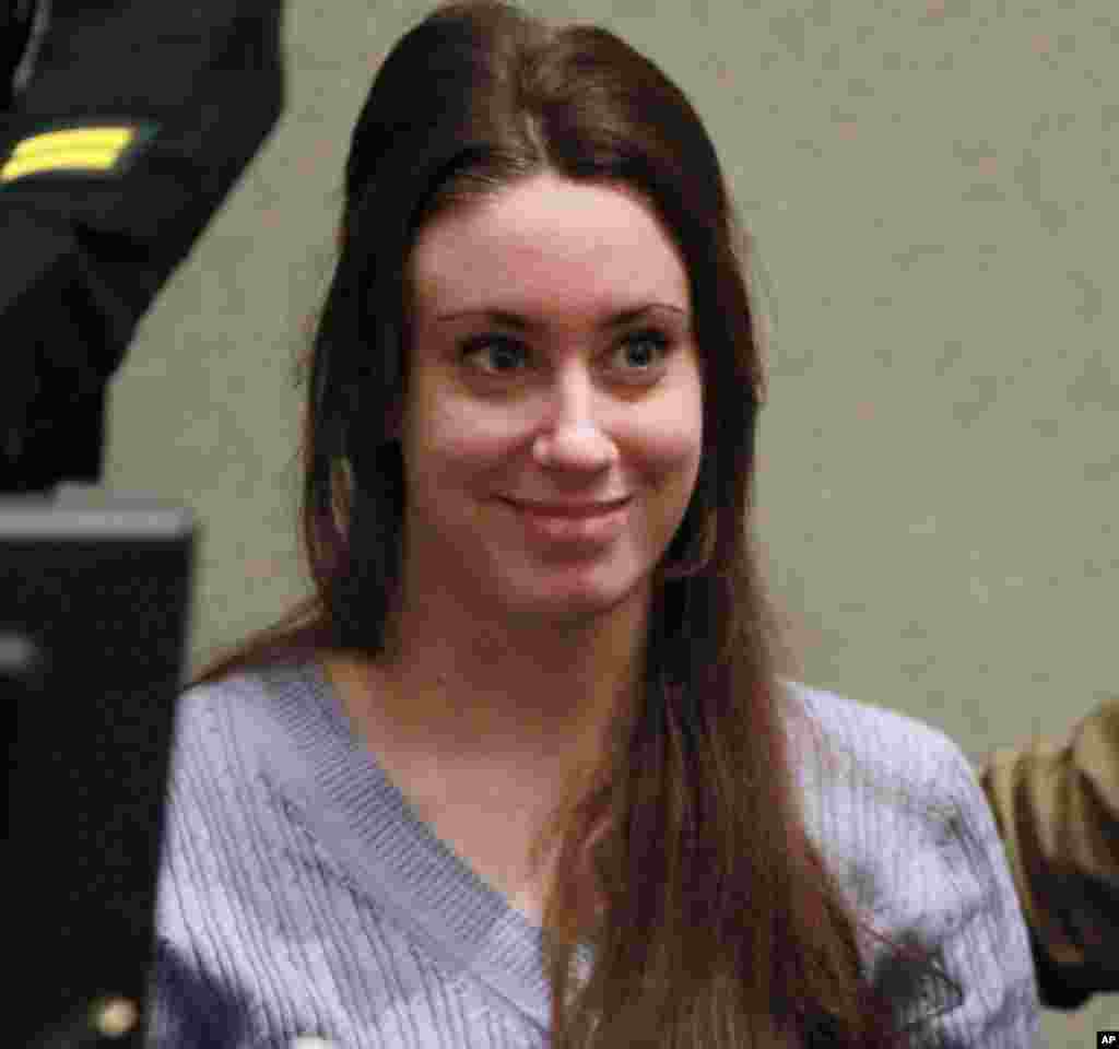 July 7: Casey Anthony smiled before the start of her sentencing hearing in Orlando, Fla. Anthony, though acquitted of abusing and killer her daughter, was sentenced to four years for lying to investigators in connection with the girls's disappearance. She