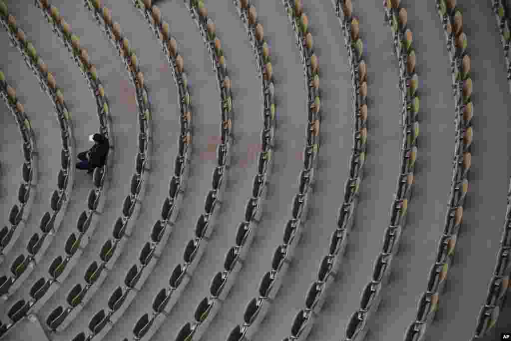 A single person watches Sofia Kenin of the U.S. and Petra Kvitova of the Czech Republic in the semifinal match of the French Open tennis tournament at the Roland Garros stadium in Paris, France.