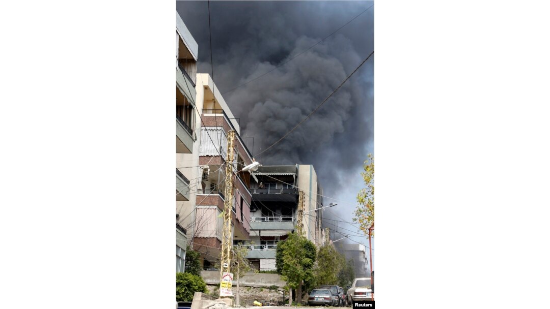 Smoke rises near a mosque complex, where hardline Sunni cleric Sheikh Ahmed al-Assir was believed to be sheltering with his supporters in Abra near Sidon, southern Lebanon, June 24, 2013.