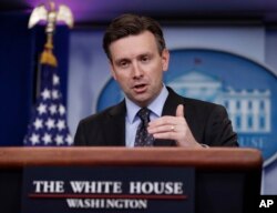 FILE - White House press secretary Josh Earnest speaks during the daily news briefing at the White House in Washington, Dec. 8, 2016.