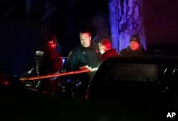 Authorities say they have in custody a "person of interest" in the shooting death of Wayne State University police officer Collin Rose in Detroit.