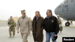 Defense Secretary Leon Panetta (R) talks with U.S. Ambassador to Afghanistan James B. Cunningham (C) and Marine General John R. Allen, commander of International Security Assistance Force, upon arriving at Kabul International Airport, December 12, 2012.