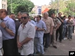 Des électeurs au Caire, le 23 mai 2012