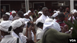 FILE - Denis Mukwege, right, is seen with staff members and patients at the Panzi Hospital he runs in Bukavu, eastern DRC. (E. Muhero/VOA)