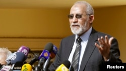 FILE - The supreme guide of Egypt's Muslim Brotherhood Mohamed Badie speaks during a news conference at the Brotherhood's main office in Cairo, Dec. 8, 2012. 