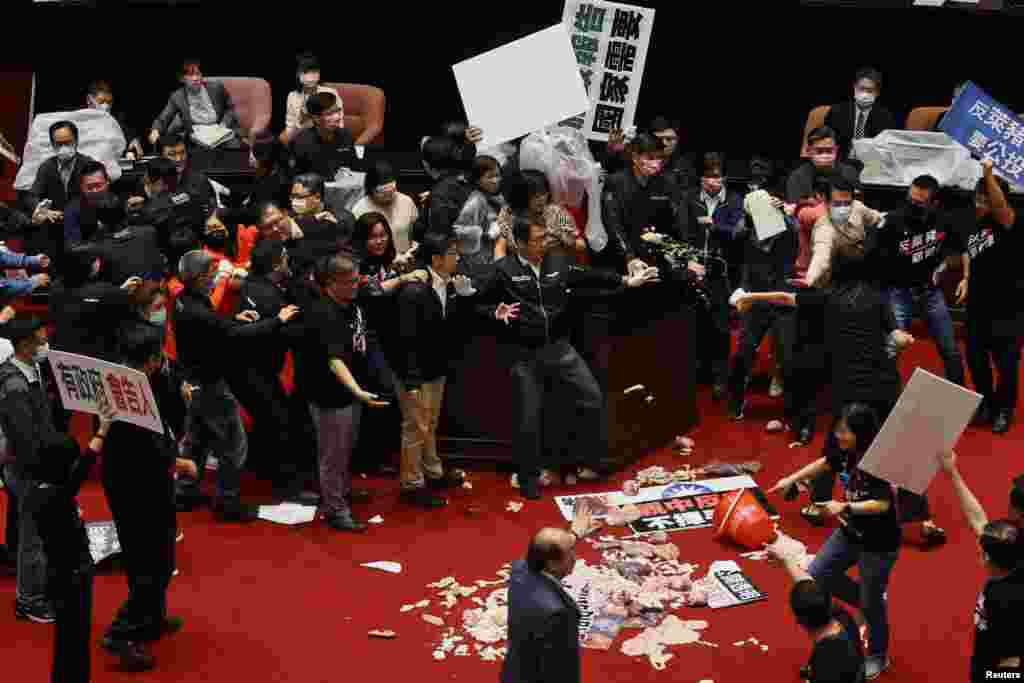 Pork intestines and other organs are seen on the ground after Taiwan lawmakers threw the parts at each other during a scuffle in the parliament in Taipei, Taiwan, November 27, 2020. REUTERS/Ann Wang