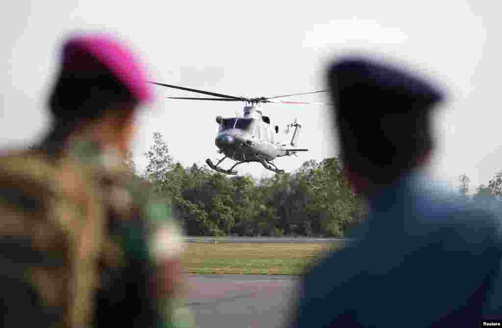 An Indonesian Navy helicopter comes in to land at the airbase where search and rescue operations for AirAsia 8501 are based in Pangkalan Bun, Central Kalimantan, Indonesia, Jan. 8, 2015.