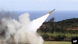 A surface-to-air missile is test fired from Jiupeng military base in Pingtung County, Taiwan, 18 Jan 2011