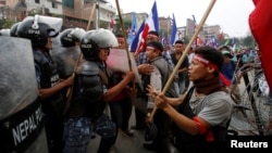 Supporters of Federal Alliance, a coalition of Madhes-based parties and other ethnic political parties and organizations, protest against the constitution near Singha Durbar office complex in Kathmandu, Nepal, May 15, 2016.