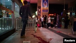 Blood is seen on the ground outside after a knife attack at Kunming railway station, Yunnan province, March 1, 2014.