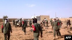 Soldiers attend to wounded and casualties in the aftermath of a suicide bomb attack who ripped through a camp grouping former rebels and pro-government militia in troubled northern Mali Jan. 18, 2017 in Gao. 