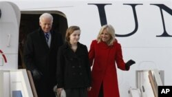 Vice President of the United States Joe Biden, left, granddaughter Finnegan and wife Jill, right, arrive at Vnukovo airport outside Moscow, Russia, March 8, 2011