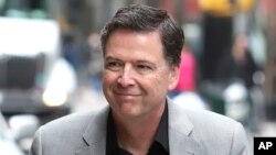FILE - Former FBI director James Comey arrives for an appearance on "The Late Show with Stephen Colbert" at the Ed Sullivan Theater, April 17, 2018, in New York.